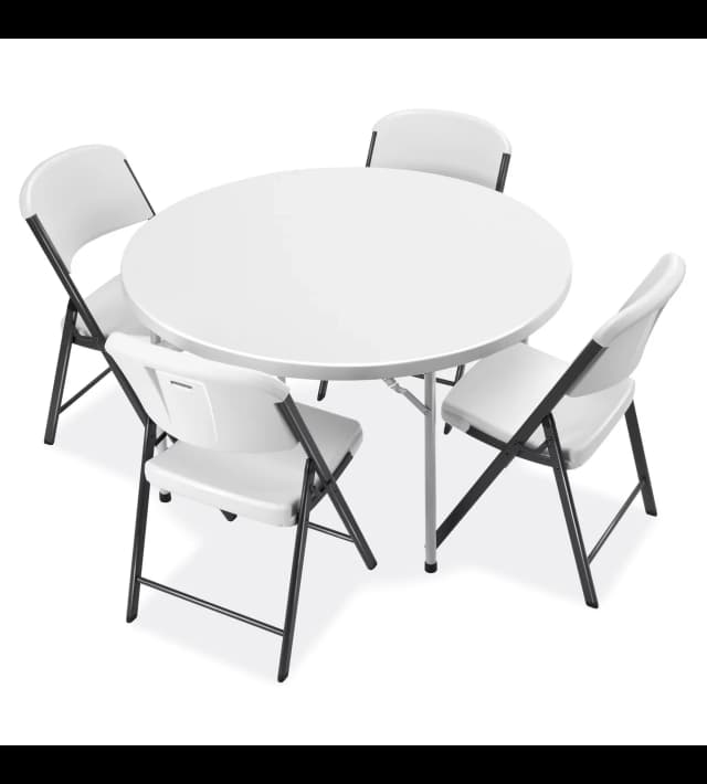 Setup view of the 48-inch white plastic round table with four chairs arranged around it for seating.