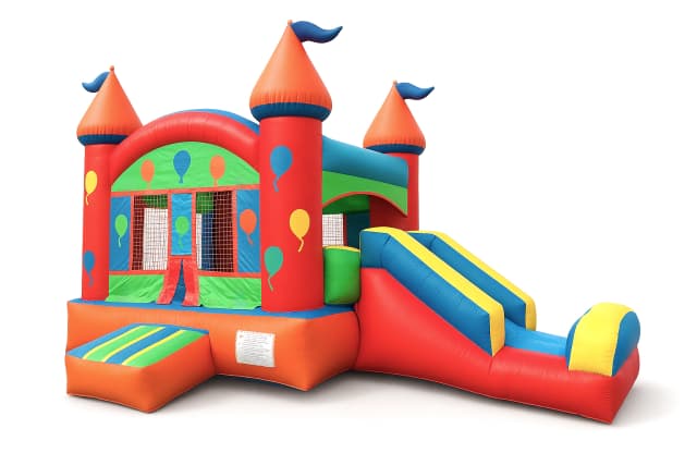 Front view of the Castle Mini Slide Party Combo showing slide and entry step on grass.